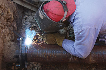 Goleta Water District Operations Tam member maintaining water pipeline.